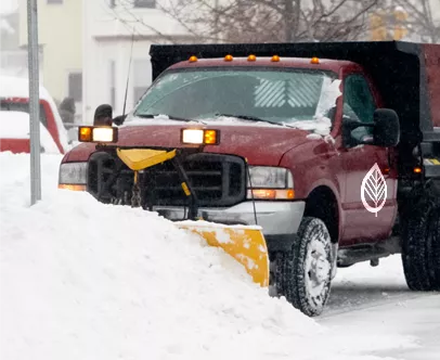 Kinnucan snow management truck plowing snow - Kinnucan's green services calendar.
