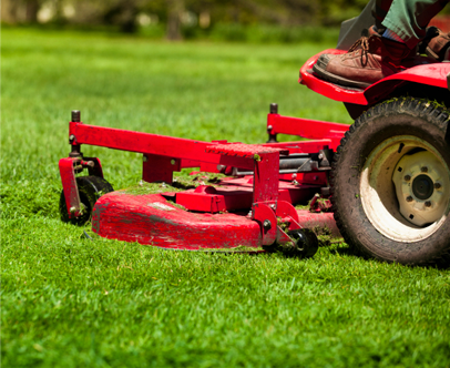 Kinnucan cutting a client's grass - Kinnucan's green services calendar.
