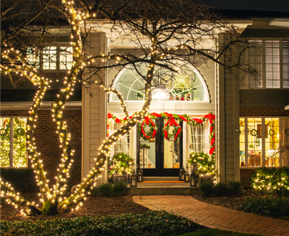 A residence with Kinnucan's holiday lighting service - Kinnucan's green services calendar.